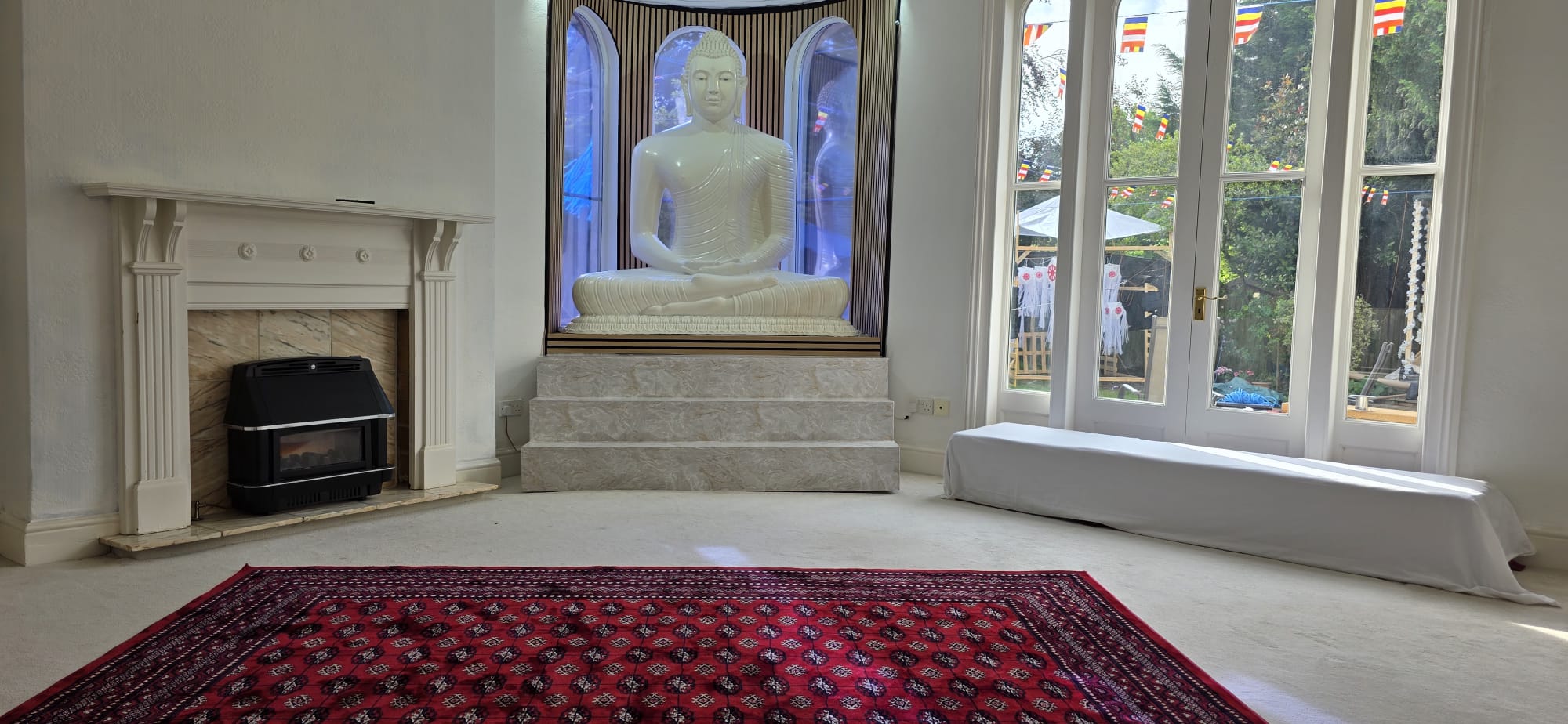 Peaceful renovated shrine room at Shanthi Vihara with Buddha statue